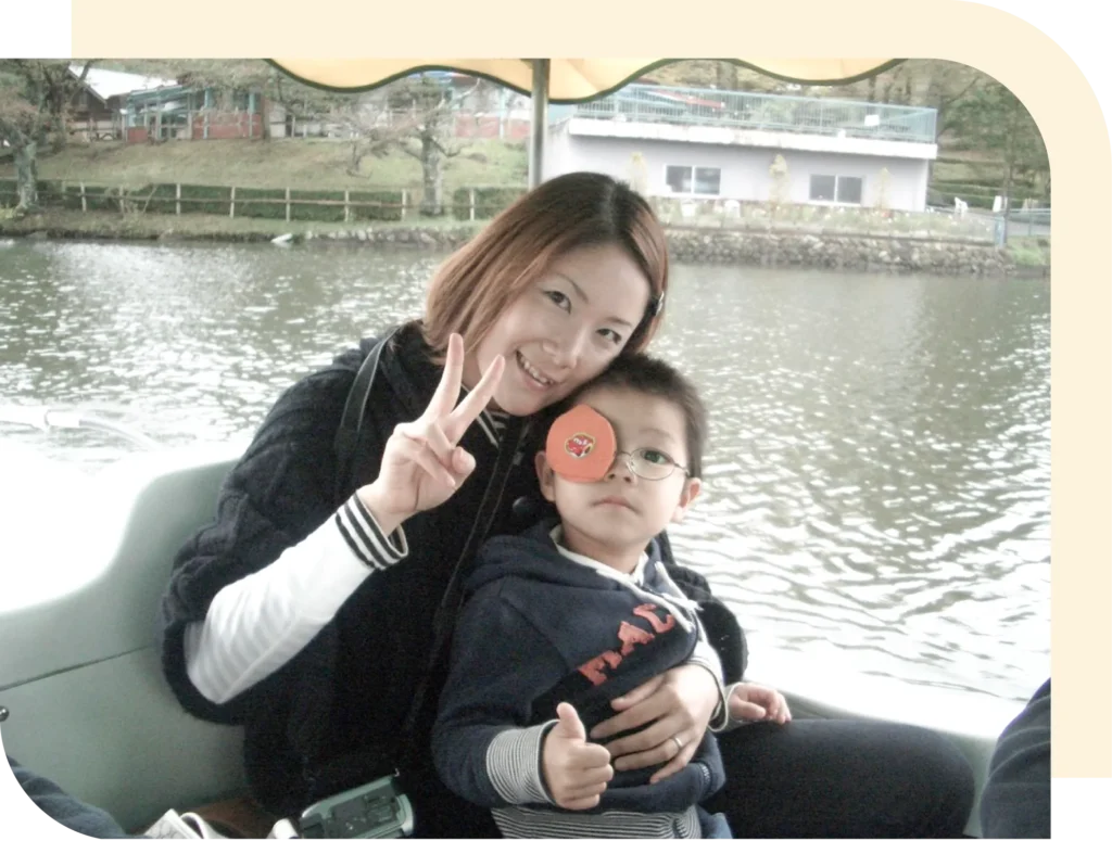 代表と幼少期の息子との写真
